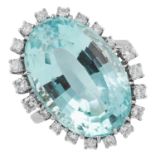 AN AQUAMARINE AND DIAMOND CLUSTER RING set with an oval cut aquamarine in border of round cut