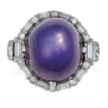 A STAR SAPPHIRE AND DIAMOND RING set with a cabochon star sapphire of approximately 26.00 carats