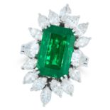A GARNET AND DIAMOND DRESS RING set with an emerald cut green garnet of approximately 11.57 carats