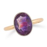 AN AMETHYST RING set with an oval cut amethyst to a plain band, size O / 7, 2.5g.