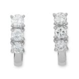 A PAIR OF DIAMOND EARRINGS each set with three round cut diamonds totalling 1.4-1.7 carats, 5.7cm,