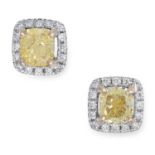 A PAIR OF YELLOW AND WHITE DIAMOND CLUSTER EARRINGS set with a yellow cushion cut diamond in a