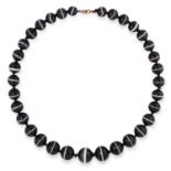 BANDED AGATE NECKLACE set with thirty three graduated beads, 54cm, 134g.