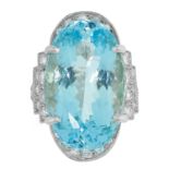 AQUAMARINE AND DIAMOND DRESS RING set with a central oval cut aquamarine of 18.03 carats and round