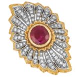 RUBY AND DIAMOND CLUSTER RING set with a round cut ruby of approximately 2.16 carats in a border