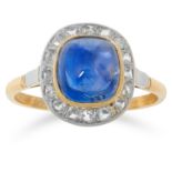 A 4.10 KASHMIR SAPPHIRE AND DIAMOND CLUSTER RING set with a sugarloaf cabochon sapphire of 4.10