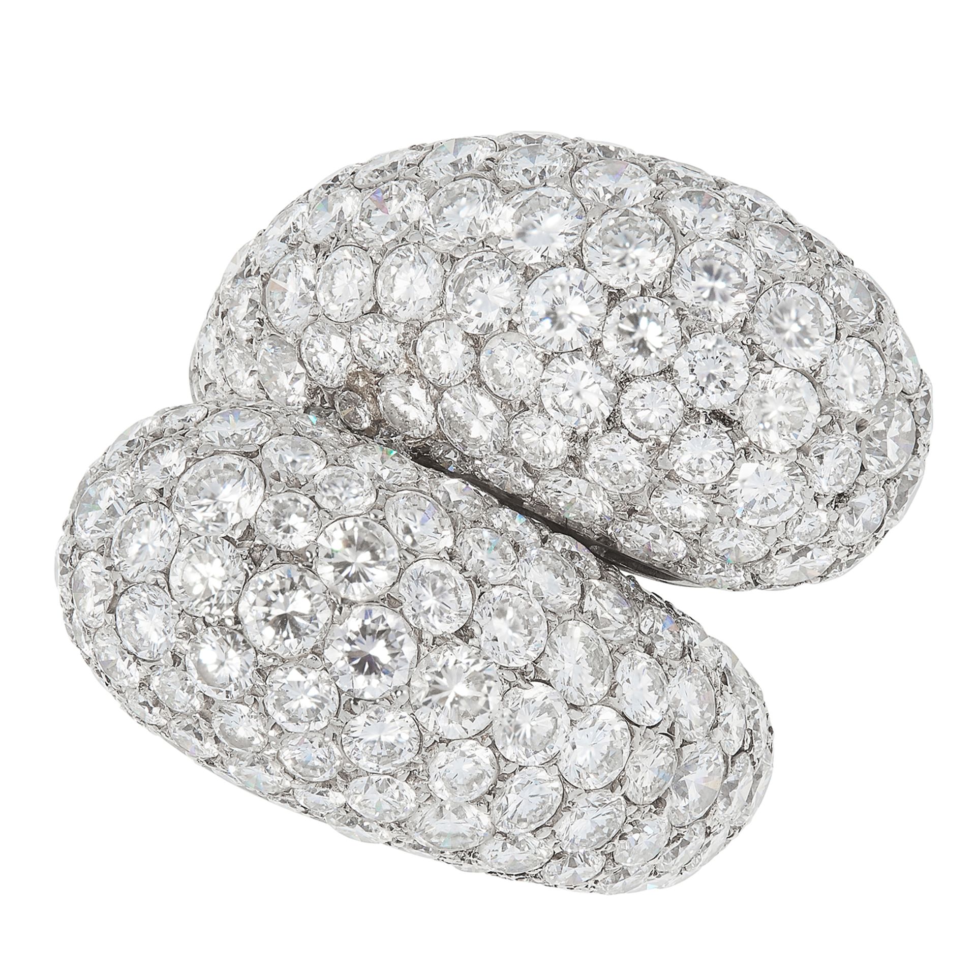 A DIAMOND CROSSOVER RING the twisted bombe design set with approximately 11.0-13.0 carats of round