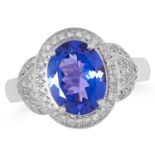 TANZANITE AND DIAMOND DRESS RING set with an oval cut tanzanite and round cut diamonds, size M /