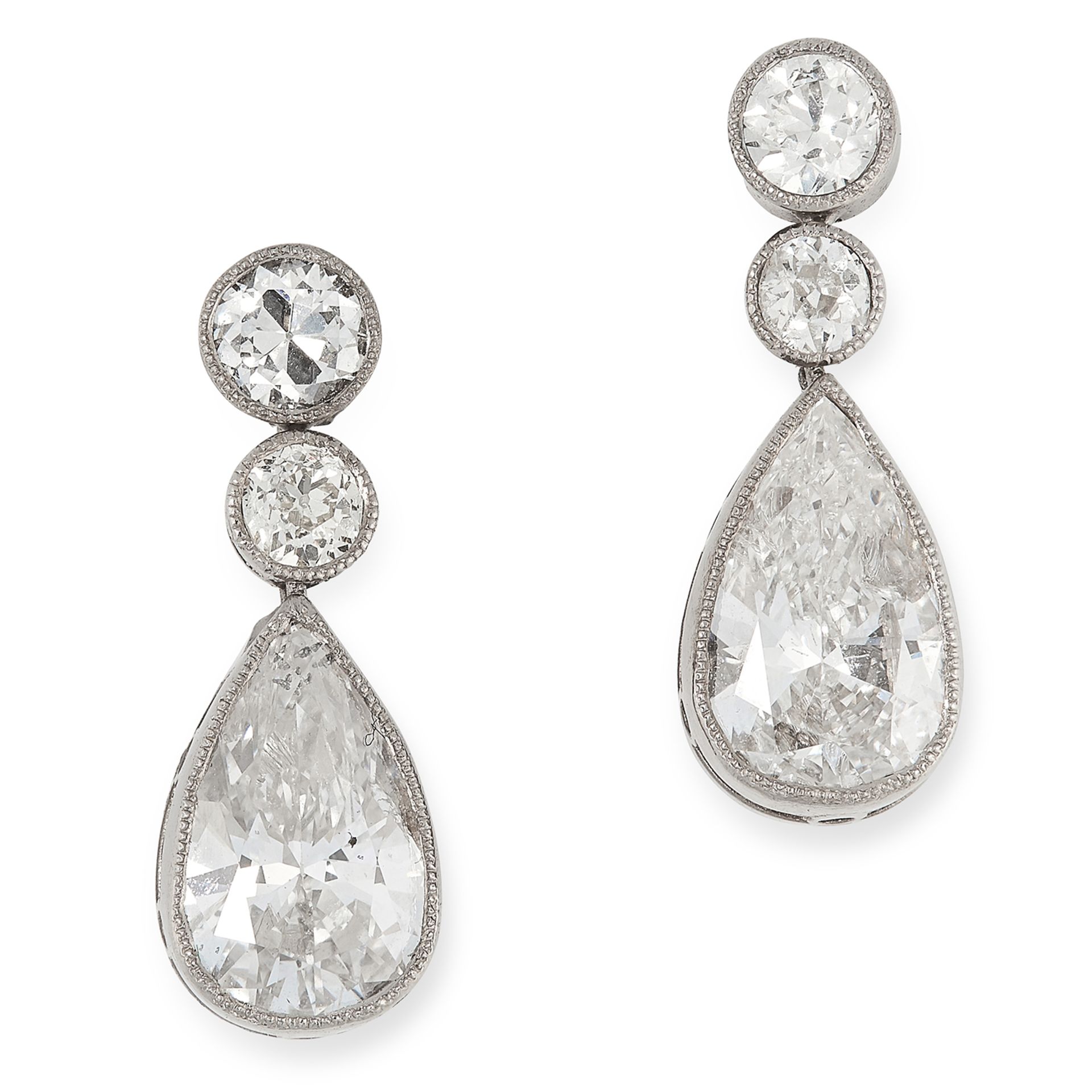 A PAIR OF DIAMOND DROP EARRINGS each set with a principal pear cut diamond of 1.07 and 1.01