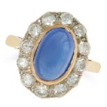 A SAPPHIRE AND DIAMOND CLUSTER RING set with a cabochon sapphire in a cluster of round cut diamonds,