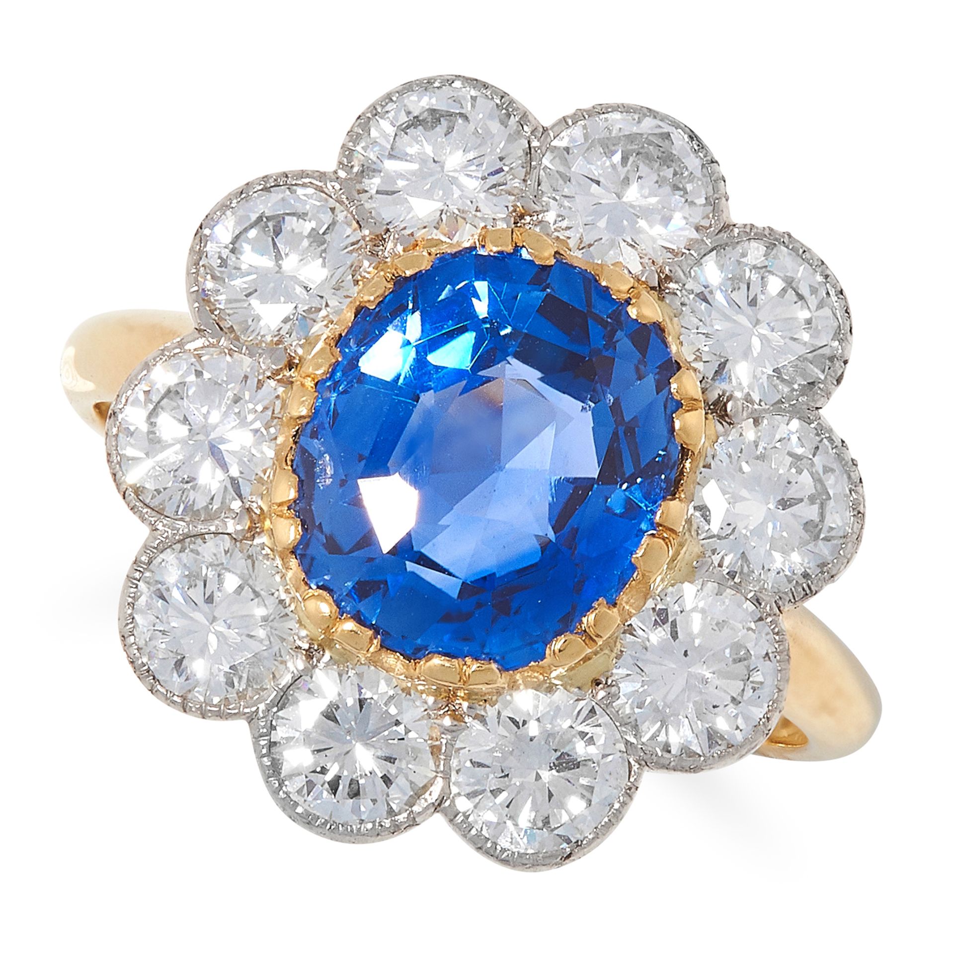 3.65 CARAT CEYLON NO HEAT SAPPHIRE AND DIAMOND CLUSTER RING set with an oval cut sapphire of 3.65