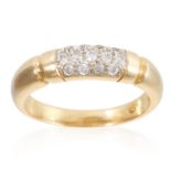 A PAVE SET CUBIC ZIRCONIA PANEL RING, in yellow gold, with grooved sides, set with round cut cubic