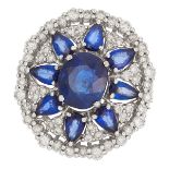 SAPPHIRE AND DIAMOND CLUSTER RING set with round and pear cut sapphires in a cluster of round cut