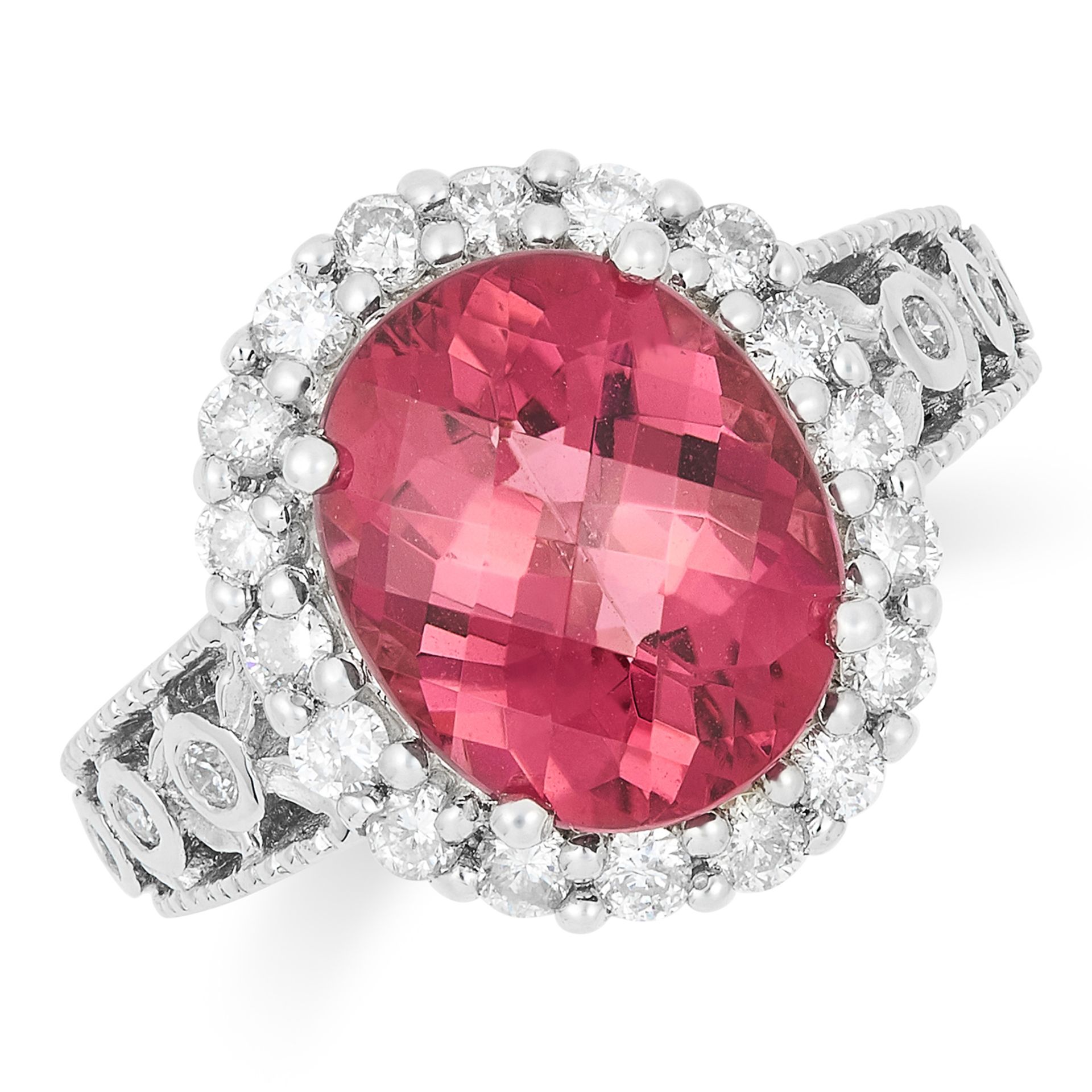 PINK TOURMALINE AND DIAMOND DRESS RING, set with a faceted oval cut tourmaline and round cut