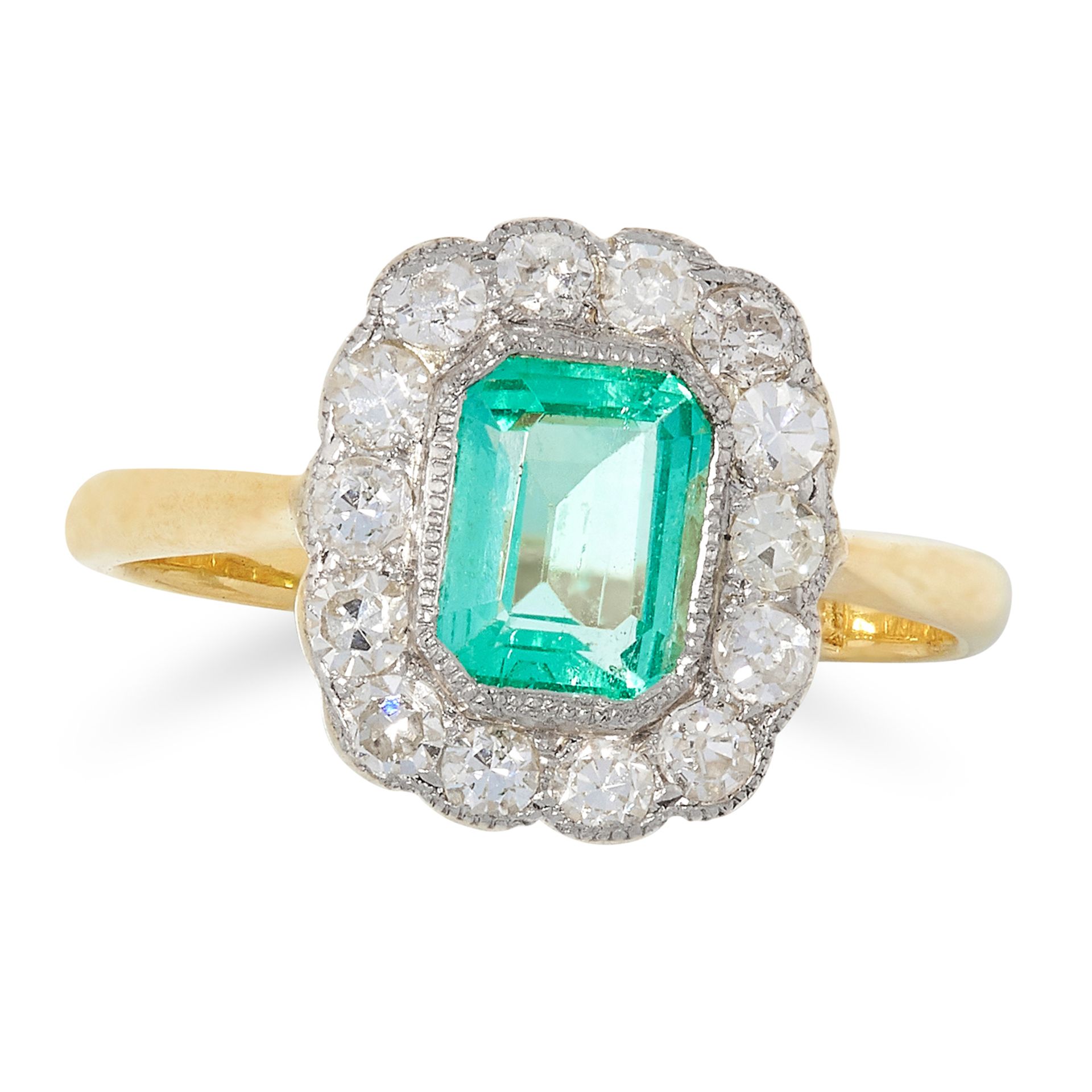 EMERALD AND DIAMOND CLUSTER RING set with an emerald cut emerald in a border of round cut