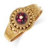 ANTIQUE VICTORIAN GARNET AND PEARL BANGLE set with cabochon garnet and a pearl, 5.5cm inner