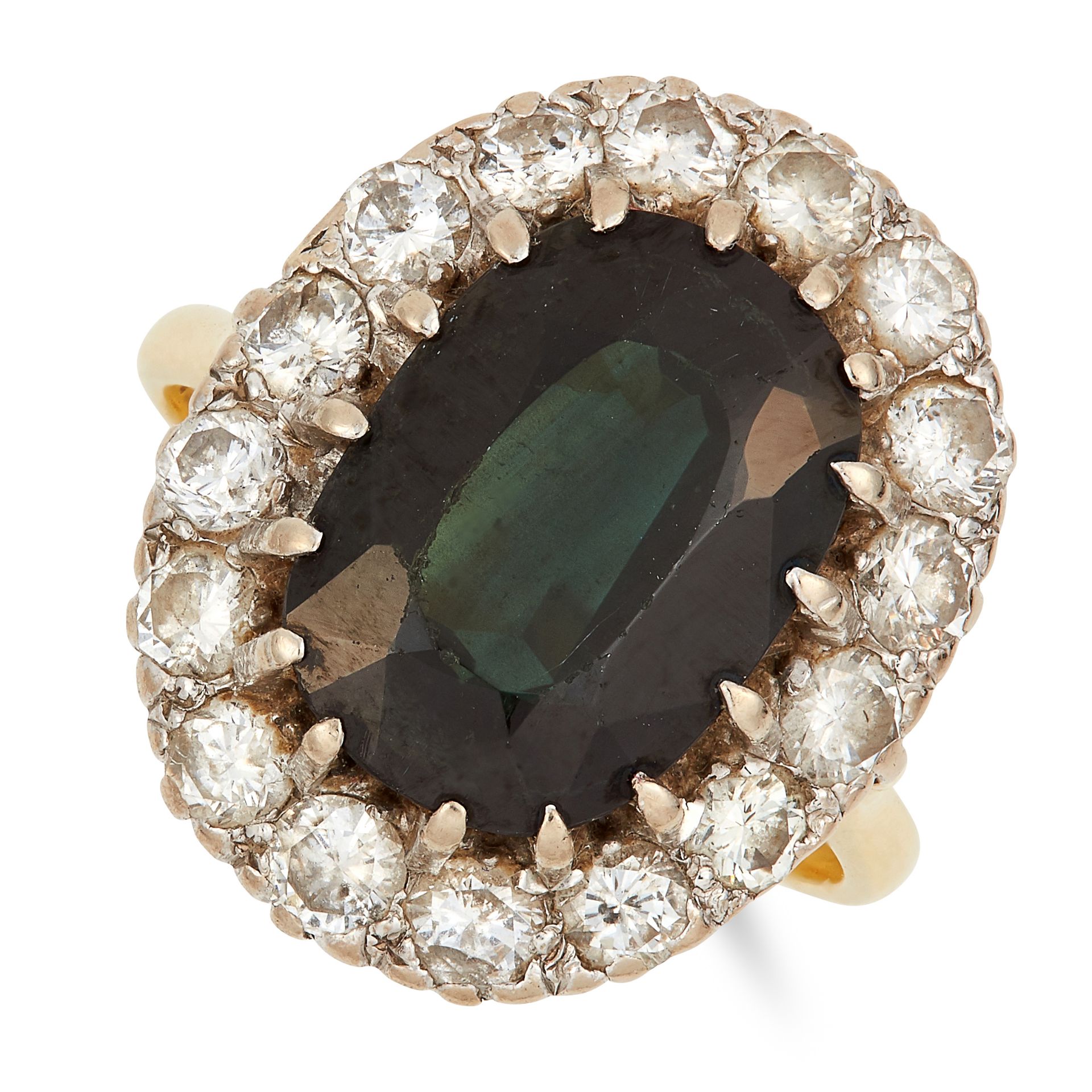 TOURMALINE AND DIAMOND CLUSTER RING set with an oval cut green tourmaline in a cluster of round