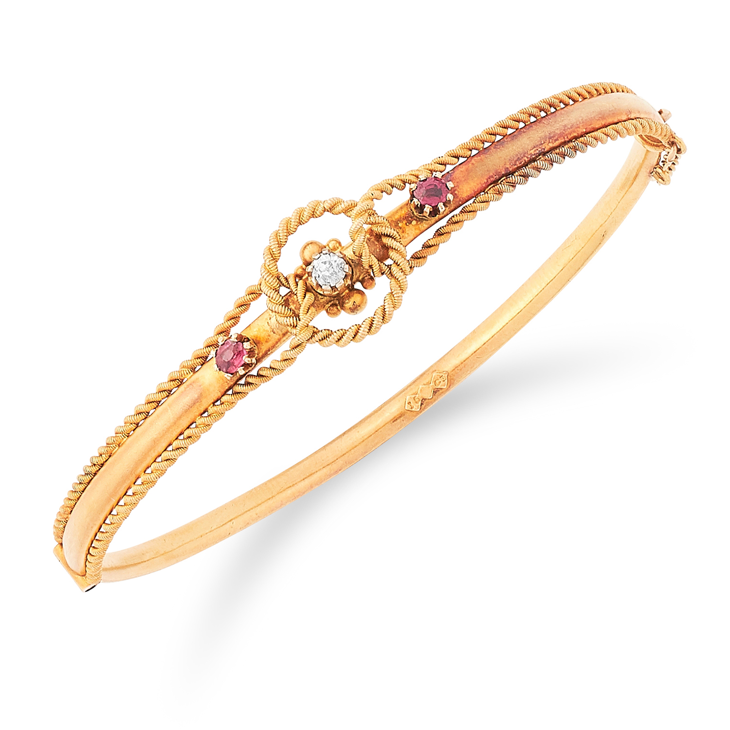 RUBY AND DIAMOND BANGLE set with two round cut rubies and a diamond in twisted gold motif, 6cm inner