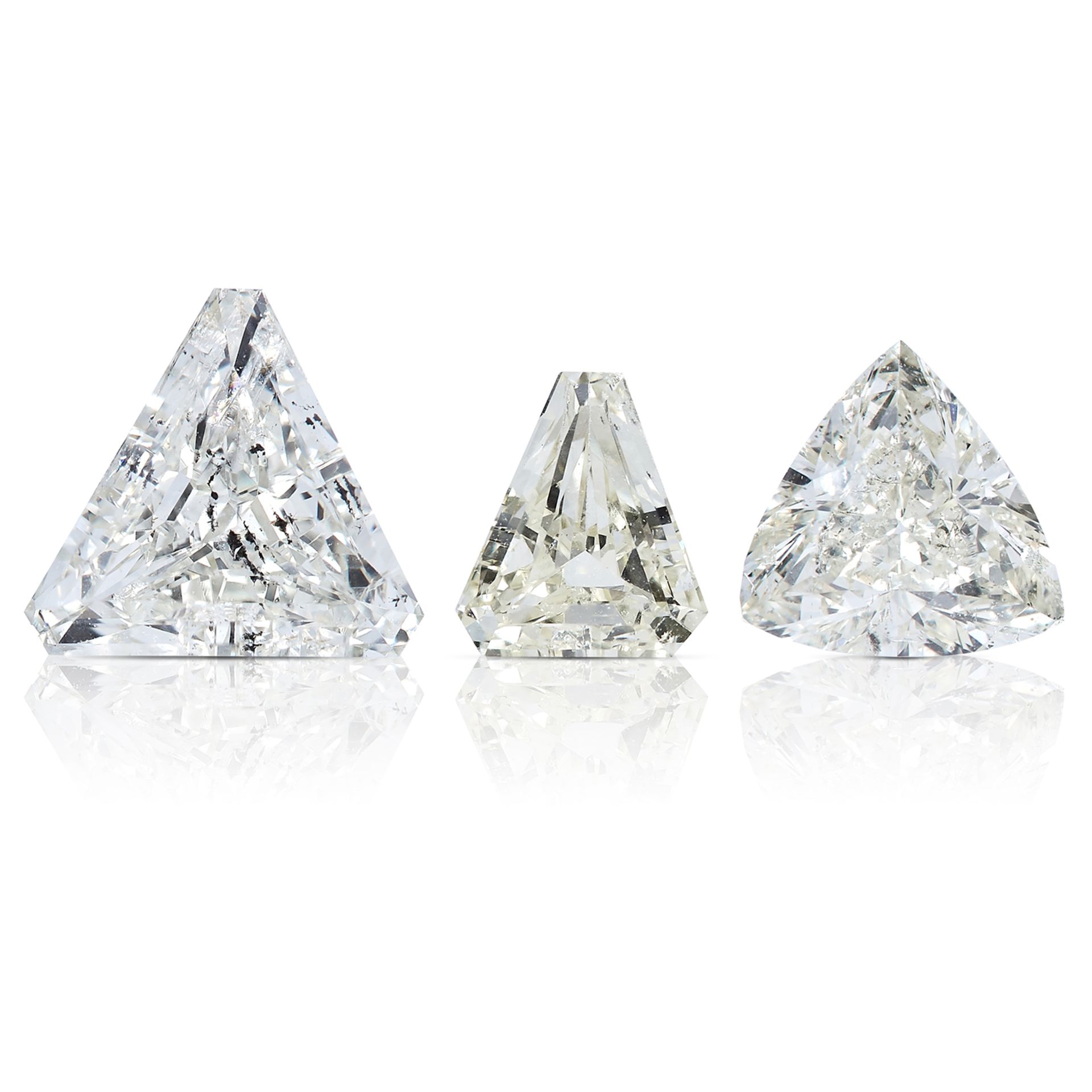 THREE MODIFIED TRILLION CUT DIAMONDS, TOTALLING 1.51cts, UNMOUNTED.