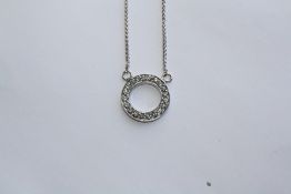 AN 18CT WHITE GOLD AND DIAMOND PENDANT