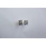 A PAIR OF 18CT WHITE GOLD AND DIAMOND STUD EARRINGS