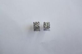 A PAIR OF 18CT WHITE GOLD AND DIAMOND STUD EARRINGS