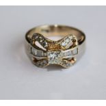 A YELLOW GOLD AND DIAMOND RING