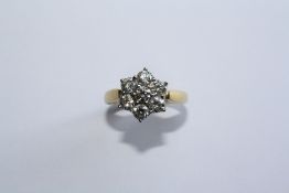 AN 18CT YELLOW GOLD AND DIAMOND RING