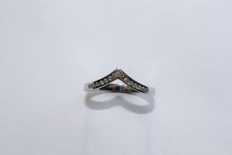 AN 18CT WHITE GOLD AND DIAMOND WISHBONE RING