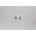 A PAIR OF 18CT WHITE GOLD AND DIAMOND STUD EARRINGS