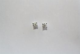 A PAIR OF 18CT WHITE GOLD AND DIAMOND STUD EARRINGS