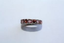 A TOURMALINE AND 9CT WHITE GOLD ETERNITY RING