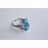 A BLUE TOPAZ AND DIAMOND RING