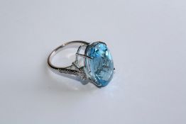 A BLUE TOPAZ AND DIAMOND RING