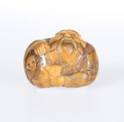 A JAPANESE STAINED IVORY NETSUKE