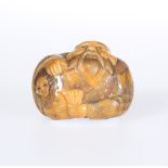 A JAPANESE STAINED IVORY NETSUKE