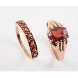TWO 9CT YELLOW GOLD AND GARNET SET RINGS