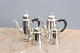 A FOUR PIECE SILVER PLATED TEA AND COFFEE SERVICE IN EARLY 18th CENTURY STYLE