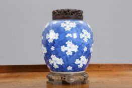 A CHINESE BLUE AND WHITE PRUNUS VASE