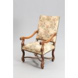 A LARGE 18TH CENTURY STYLE CONTINENTAL WALNUT AND UPHOLSTERED ARMCHAIR, 19TH CENTURY