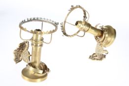 A PAIR OF LATE 19TH CENTURY BRASS CANDLE GIMBLES