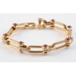 AN 18CT YELLOW GOLD, RUBY AND DIAMOND BRACELET BY VOURAKIS