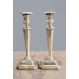 A PAIR OF GEORGE V SILVER CANDLESTICKS