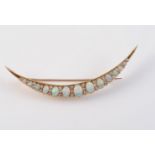 A LATE 19TH CENTURY OPAL AND DIAMOND SET CRESCENT BROOCH