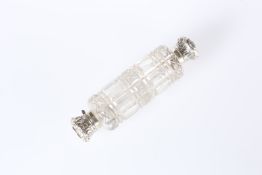 A LATE VICTORIAN WHITE-METAL MOUNTED CUT-GLASS DOUBLE-ENDED SCENT BOTTLE