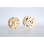 TWO 19TH CENTURY CHINESE IVORY PUZZLE BALLS