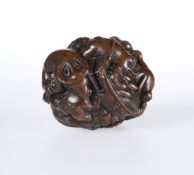 A JAPANESE CARVED WOODEN BALL