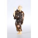 A JAPANESE IVORY AND WOOD FIGURAL NETSUKE