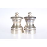 A PAIR OF SILVER "PETER PIPER" SALT AND PEPPER MILLS