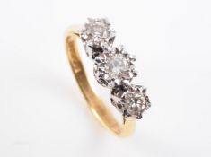 AN 18 CARAT GOLD AND DIAMOND RING